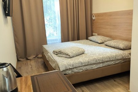 Кровать в номере 2 в отеле Александрия
