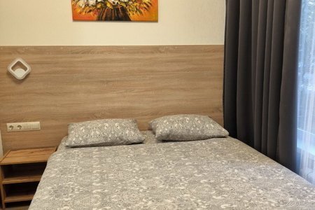 Кровать в номере 5 в отеле Александрия