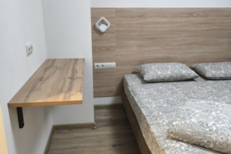 Кровать в номере 7 в отеле Александрия