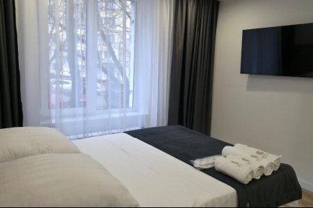 Большая кровать в номере Стандарт №10 в отеле Buta Hotel 4