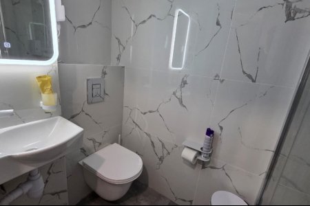 Душевая комната в номере Эконом №6 в отеле Buta Hotel 4