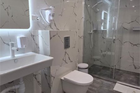 Душевая комната в номере Комфорт №7 в отеле Buta Hotel 4