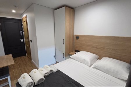 Кровать в номере Эконом №6 в отеле Buta Hotel 4