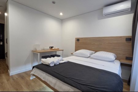 Кровать в номере Стандарт №10 в отеле Buta Hotel 4