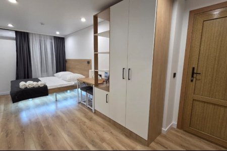 Шкаф в номере Комфорт №7 в отеле Buta Hotel 4