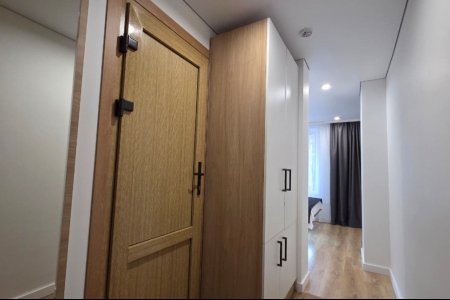 Шкаф в номере Стандарт №10 в отеле Buta Hotel 4