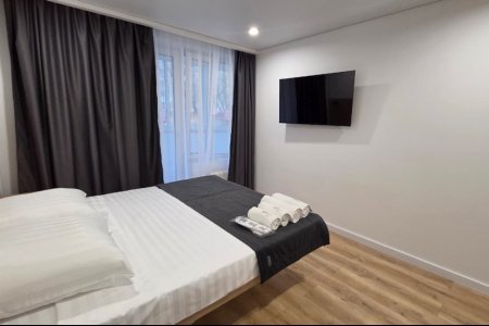Спальная зона в номере Комфорт №3 в отеле Buta Hotel 4
