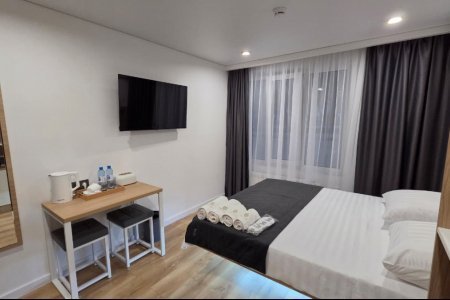 Спальная зона в номере Комфорт №4 в отеле Buta Hotel 4