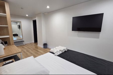 Спальная зона в номере Комфорт №7 в отеле Buta Hotel 4