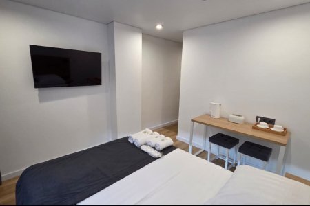 Спальная зона в номере Стандарт №10 в отеле Buta Hotel 4