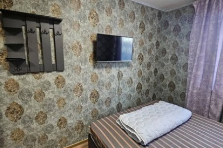 Спальная зона в номере в отеле LemonLime Hotel