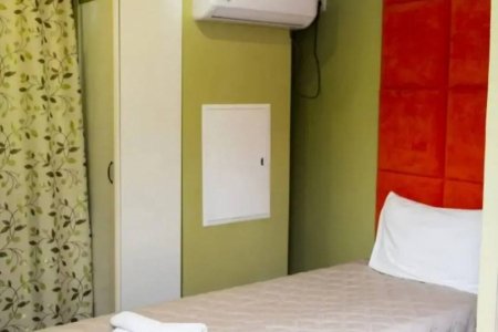 Кровать в одноместном номере в отеле Littlehotel  