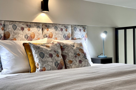 Кровать в номере Studio Suite в Prive Luna