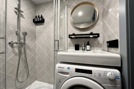 Стиральная машина в номере Studio Suite в Prive Luna
