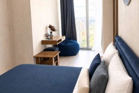 Кровать в студии 22 м² в апартаментах Москва-Сити
