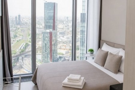 Спальная зона в апартаментах 54-6 в Москва-Сити