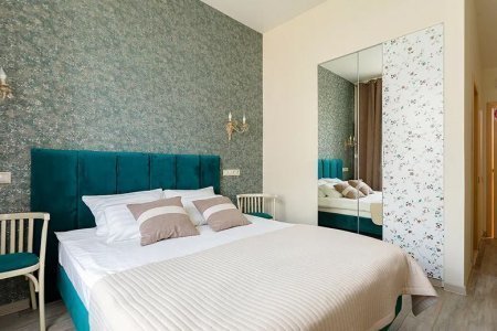 Кровать в номере Зеленый в отеле Пушка
